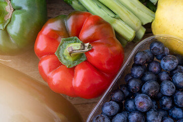 Fresh mixed bio vegetable and fruits in wooden basket harvested in the morning. Bio box from regional local farmers market concept