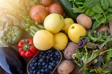 Bio vegetable and fruits in wooden basket harvested in the morning. Bio box from regional local farmers market concept