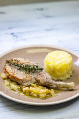 pork chop with thyme baked on creamy onion with mashed potatoes