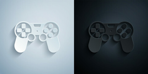 Paper cut Game controller or joystick for game console icon isolated on grey and black background. Paper art style. Vector © Iryna