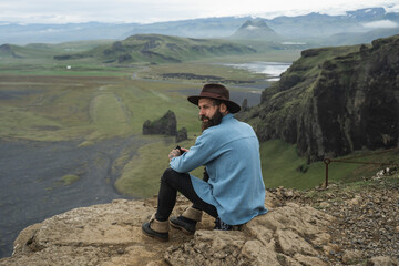 Male person spending his weekend at the moss hills of the Iceland and enjoying