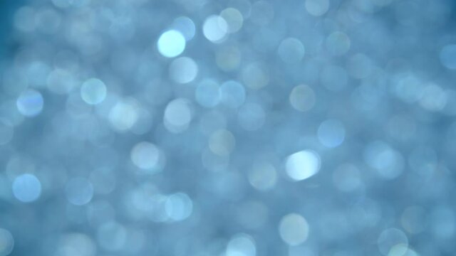 Abstract background of blue bokeh spinning