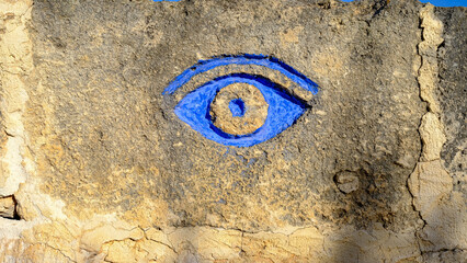 Líthica, Pedreres de s'Hostal, Menorca, Balearic Islands, Spain. Sandstone quarry. eye painted on the wall