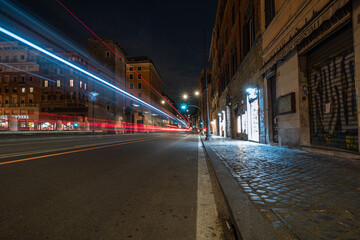 Cool long exposure cars traffic light trails, night view of the city of Rome.