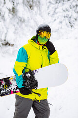 Fototapeta na wymiar man snowboarder in ski equipment