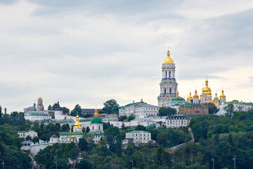 Pechersk Lavra on the slopes of the Kyiv hills on a cloudy summer day.