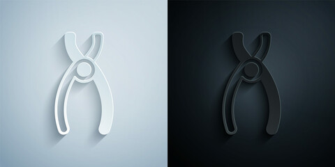Paper cut Dental pliers icon isolated on grey and black background. Dental equipment. Paper art style. Vector