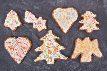 Fresh baked gingerbread in shape of christmas tree, heart and star with colorful decorations for Christmas time