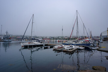 Fototapeta na wymiar View of the beautiful city of Torshavan and its marina with sailing boats in the Faroe Islands 