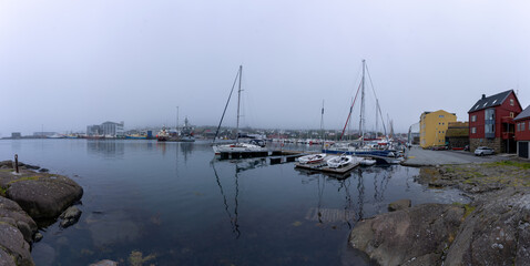 Fototapeta na wymiar View of the beautiful city of Torshavan and its marina with sailing boats in the Faroe Islands 