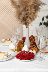 Table set with beautiful autumn decor for festive dinner