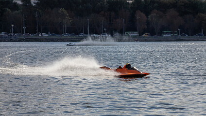 Fototapeta premium sport. motor boat races. speed, water sports. competition on the water on a sunny day