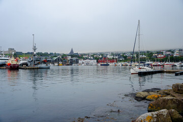 Fototapeta premium View of the beautiful city of Torshavan and its marina with sailing boats in the Faroe Islands 