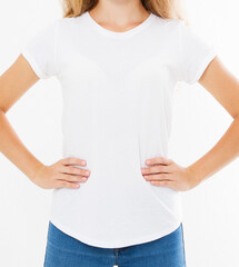 Midsection of young woman wearing blank tshirt on white background
