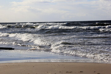Fototapeta premium Seascape during a storm with large waves, Carnikava, Latvia. Big and powerful sea waves during the storm 
