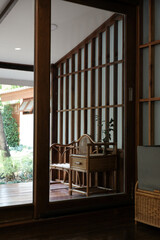 Wooden table and chair are located on the balcony