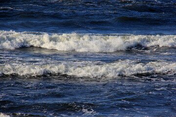 Seascape during a storm with big waves, close-up, Carnikava, Latvia. Big and powerful sea waves during the storm