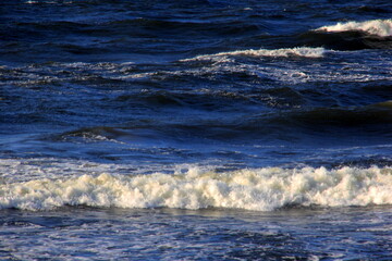 Seascape during a storm with big waves, close-up, Carnikava, Latvia. Big and powerful sea waves during the storm