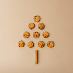 Flat lay composition of chocolate chip cookies arranged in shape of pine tree. Christmas tree concept.