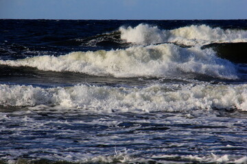 Naklejka premium Seascape during a storm with big waves, close-up, Carnikava, Latvia. Big and powerful sea waves during the storm 