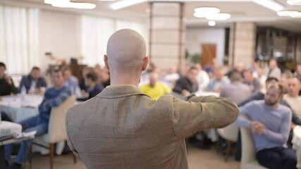 Male Speaker man public on stage speaking talking business conference with presentations. People audience at hall, Seminar, conference, meeting, colleagues, team, training, corporate coaching concept