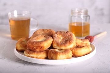 fresh cheesecakes with tea are on the table