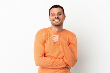 Brazilian man over isolated white background laughing