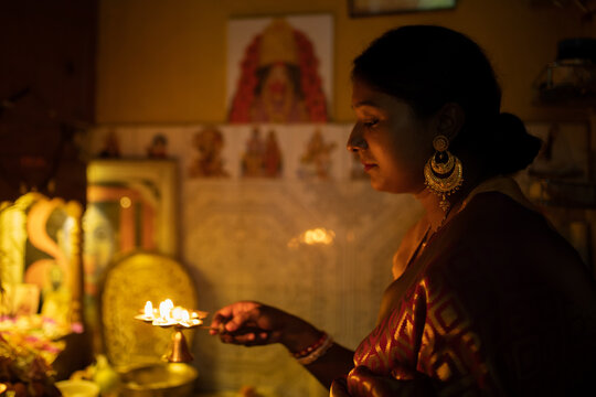 Worshipping with Diya