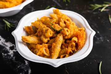 Pasta with pumpkin and welnuts, a complete vegetarian dish. Ideal for an autumn lunch