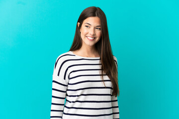 Fototapeta premium Teenager Brazilian girl over isolated blue background looking to the side and smiling