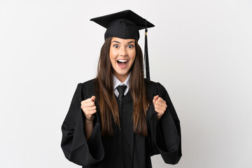 Teenager Brazilian university graduate over isolated white background celebrating a victory in...