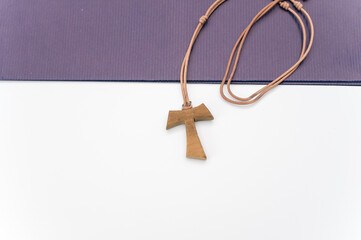 isolated hand made wooden tau cross pendant - Greek letter tau