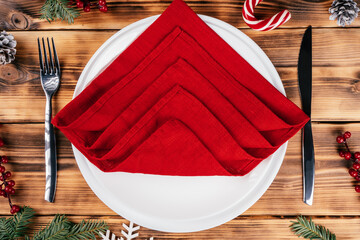 Step-by-step tutorial: Fold linen napkin in shape of Christmas tree. Step 3: Same way set four...