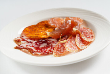 meat appetizer on the white plate