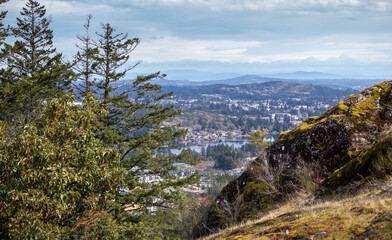 view of small lake and community in the mountains on Vancouver Island, British Columbia in Canada