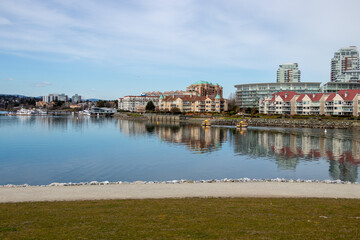 water taxis in Victoria's harbour going by David Foster Way walking path