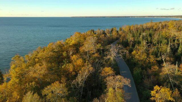 Aerial view Lake Michigan shoreline in October. Autumn yellow orange foliage. Midwest Parks. Cave Point County Park, Wisconsin