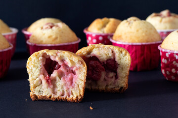 Homemade muffins stuffed with different berries: cherries, strawberries.