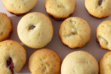 Delicious sweet muffins with different fillings: banana, strawberry, apple. Close up. Texture