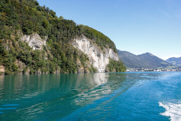 Fototapeta na wymiar Swiss landscape on a lake with mountains