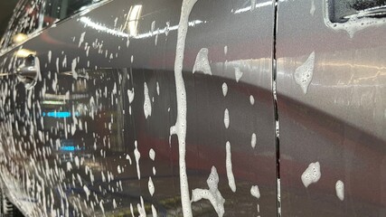 Active contactless foam auto shampoo on the car wash