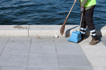 Streetcleaner, scavenger, garbageman, dustman, sweeper stock photo.