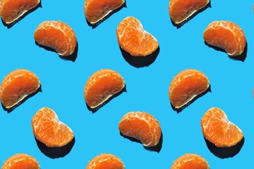 seamless pattern of tangerine slices on a blue background
