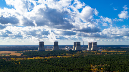 Fototapeta na wymiar Nuclear power plant and cooling towers aerial view