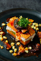 Causa de Limeña, made with sweet potatoes accompanied by octopus and corn.
