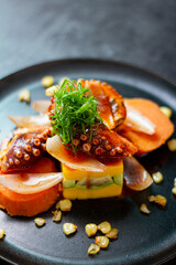 Causa Limeña, accompanied by juicy octopus, corn and sweet potato.
