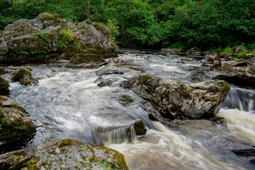 Fototapeta premium River flowing over rocks in Scotland