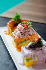 Limeñas Trio of Causes, Cause of Olive Octopus, Cause of Sweet Potato with Octopus, Cause of Spicy Potato with Ceviche
