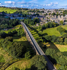 An aerial panorama over the Thornton viaduct towards the town of Thornton, Yorkshire, UK in...