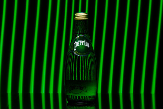 Bottle of Perrier sparkling water. Perrier is a French brand of natural bottled mineral water sold worldwide. MINSK, BELARUS - October 22, 2021.
